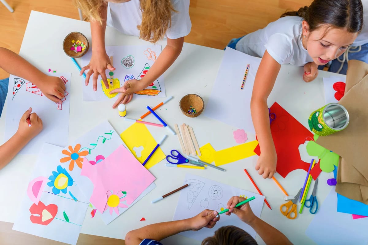 Children working on colorful craft projects together
